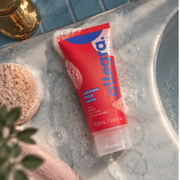 Sabonete Facial Neutro Limpa e Hidrata Allegra 100ml, bisnaga sobre bancada de mármore